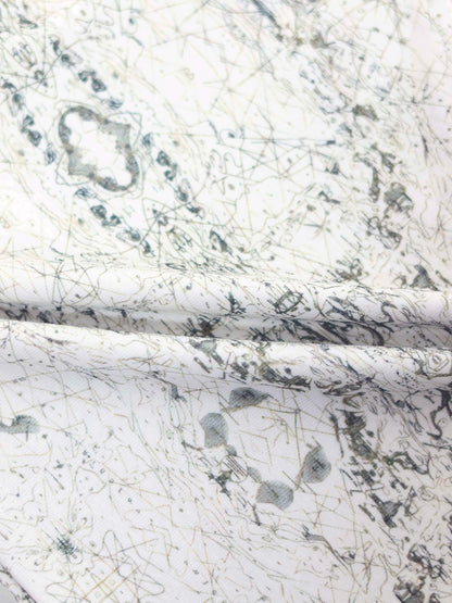 Off-white Map Beanie fabric with sketched map pattern, compass markers and decorative stitching.