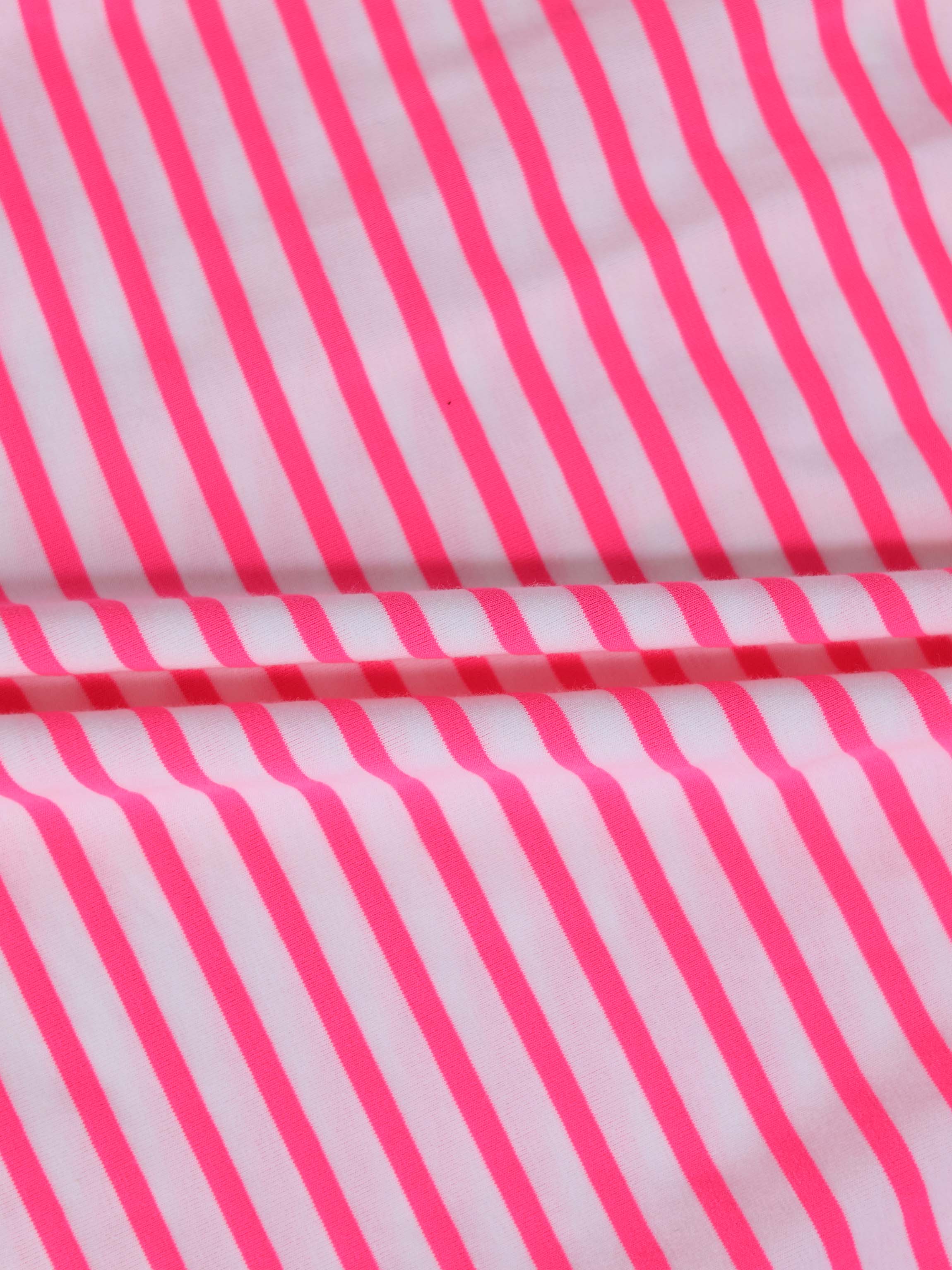 Neon pink striped fabric for a short-sleeve dress, bold vertical stripes on white.