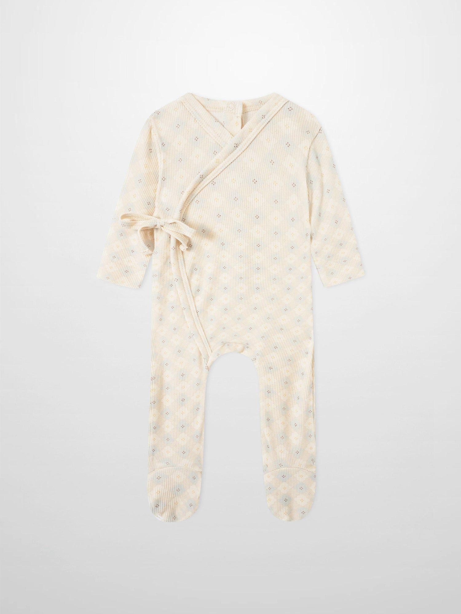 Little Button Blue layette set; cream wrap-style baby romper with tie belt and tiny floral dots