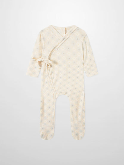 Little Button Blue layette set; cream wrap-style baby romper with tie belt and tiny floral dots