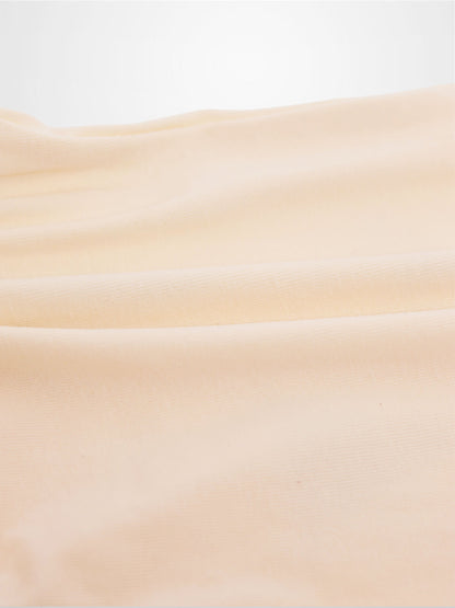 Soft peach fabric close-up for Sail Boat Romper, subtle knit texture.