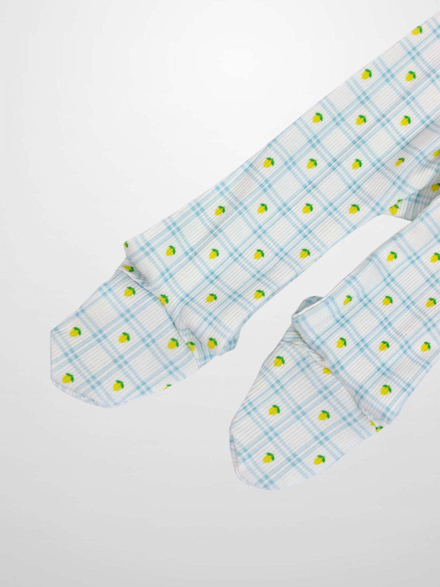 Lemon Window Stretchy baby boy footie on white base with light blue grid plaid and tiny yellow lemons.