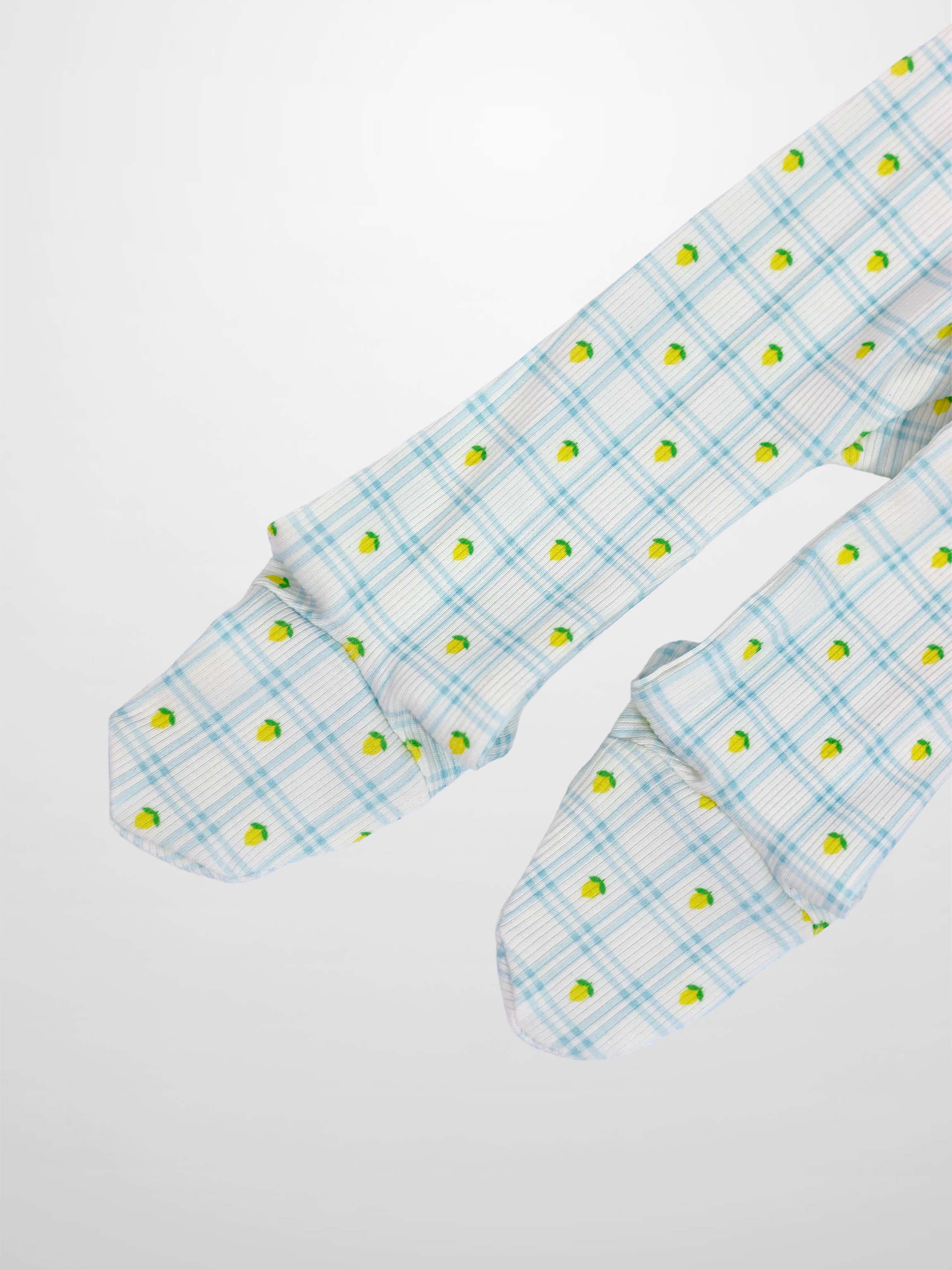 Lemon Window Stretchy baby boy footie on white base with light blue grid plaid and tiny yellow lemons.