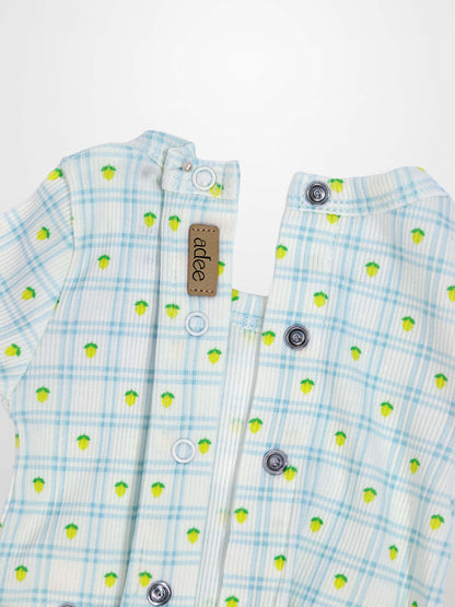 Lemon Window Stretchy baby romper with light blue grid plaid and scattered yellow lemons, snap closures.