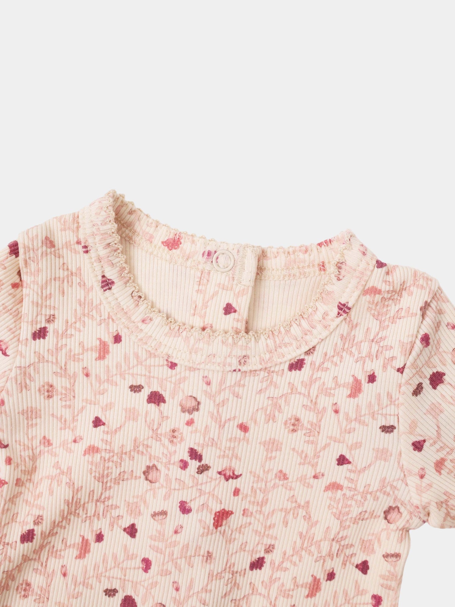 Adee Garden Sprinkles girls layette top in pink floral ribbed fabric with a ruffled neckline and white button
