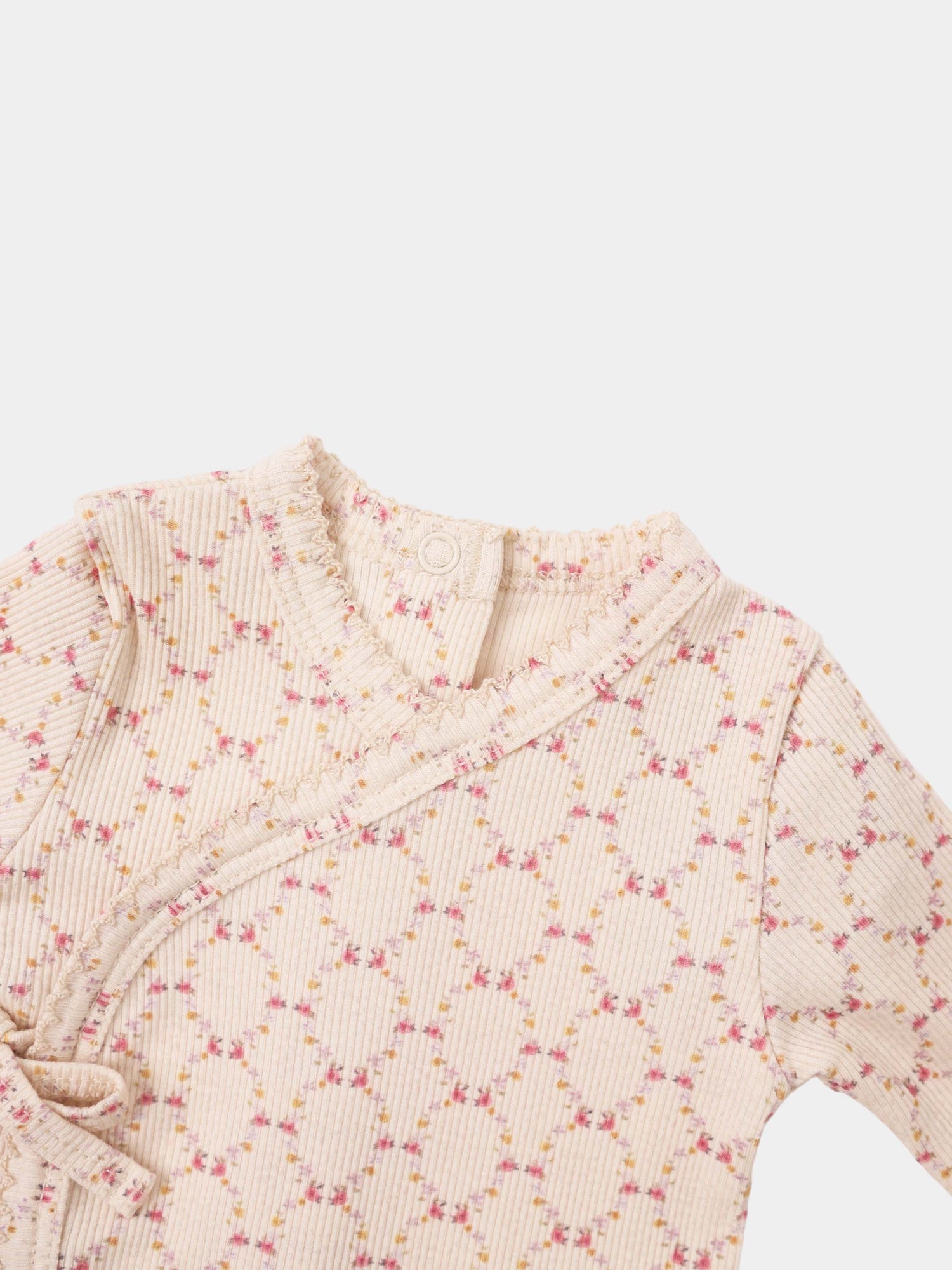 Adee Floral Garland layette set; pale pink ribbed knit with tiny pink and yellow flowers and ruffled edges.