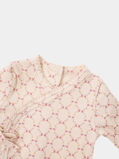 Adee Floral Garland layette set; pale pink ribbed knit with tiny pink and yellow flowers and ruffled edges.