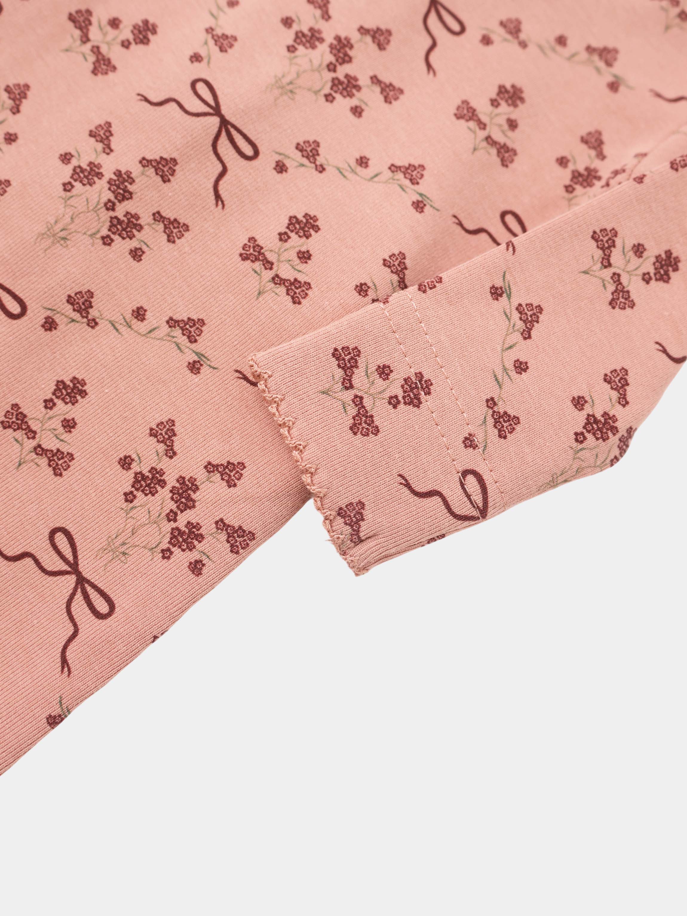 Bow Bouquet layette set for girls in pink with burgundy floral clusters and ribbon bows.