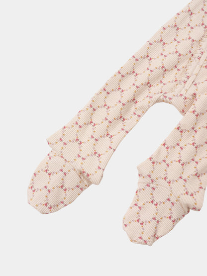 Floral Garland layette set by Adee; beige ribbed fabric with pink and yellow floral garland pattern on baby sleeves