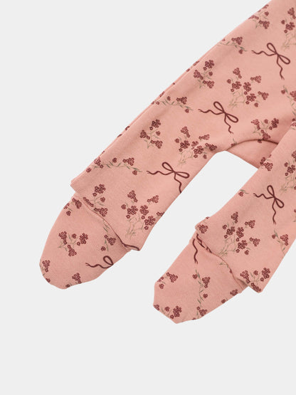 Bow Bouquet layette set by Adee; pink knit fabric with burgundy floral clusters and bow accents on sleeves.