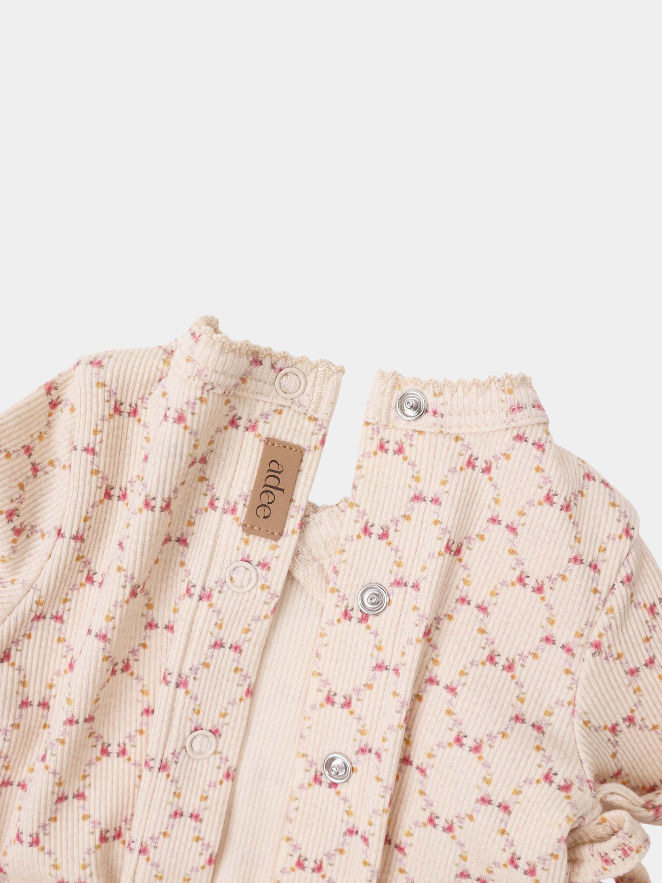 Adee Floral Garland Layette Set; beige ribbed fabric with tiny pink and yellow floral print and snap-button closures.