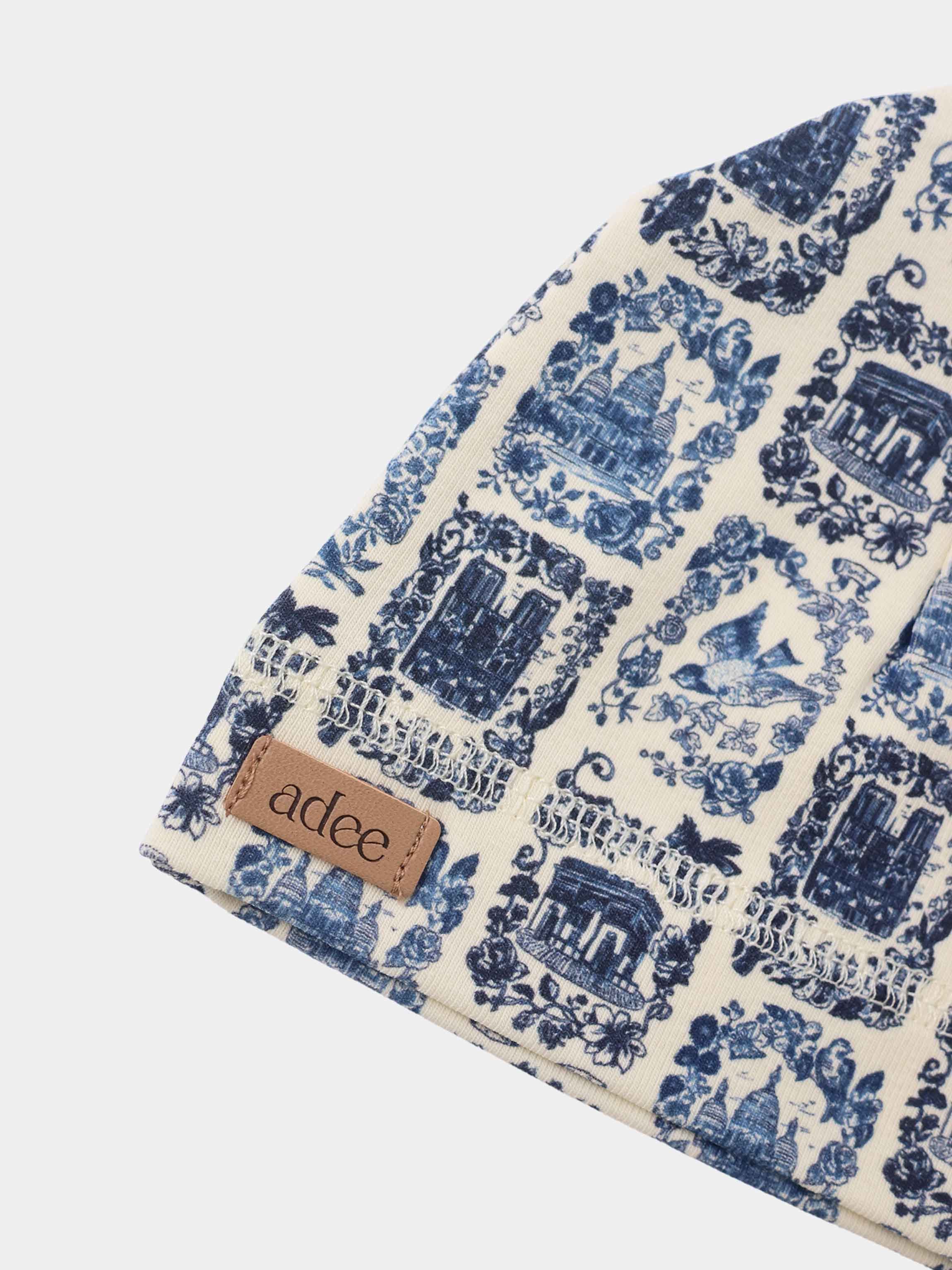 Blue Landmark layette set by Adee; cream fabric with blue toile print for baby boys