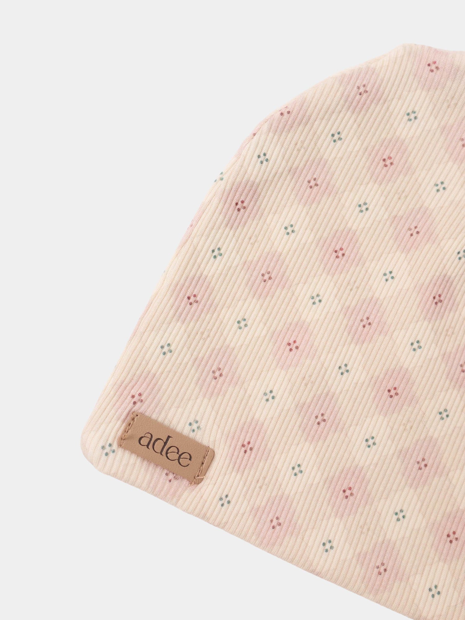 Little Button Pink Layette Set by Adee; pale pink ribbed knit with small teal and pink dots.