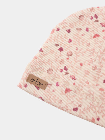 Garden Sprinkles layette set in pink floral ribbed fabric with visible Adee label