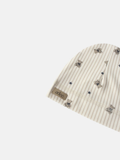 Striped Bear Hat for boys by Adee; beige striped fabric with tiny bear prints and brand tag.