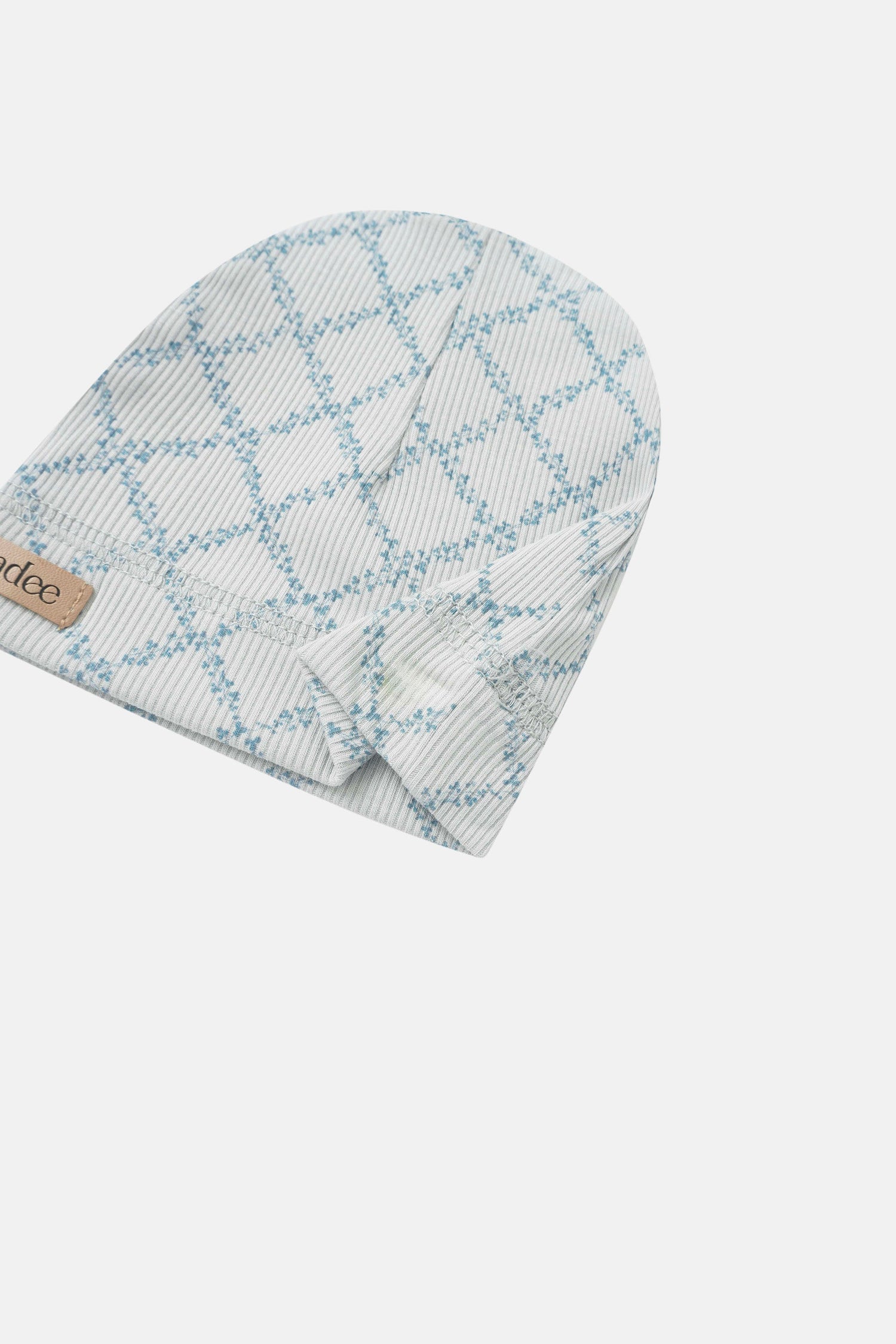 Blue Leaf layette hat by Adee for boys with light blue lattice pattern and brand tag