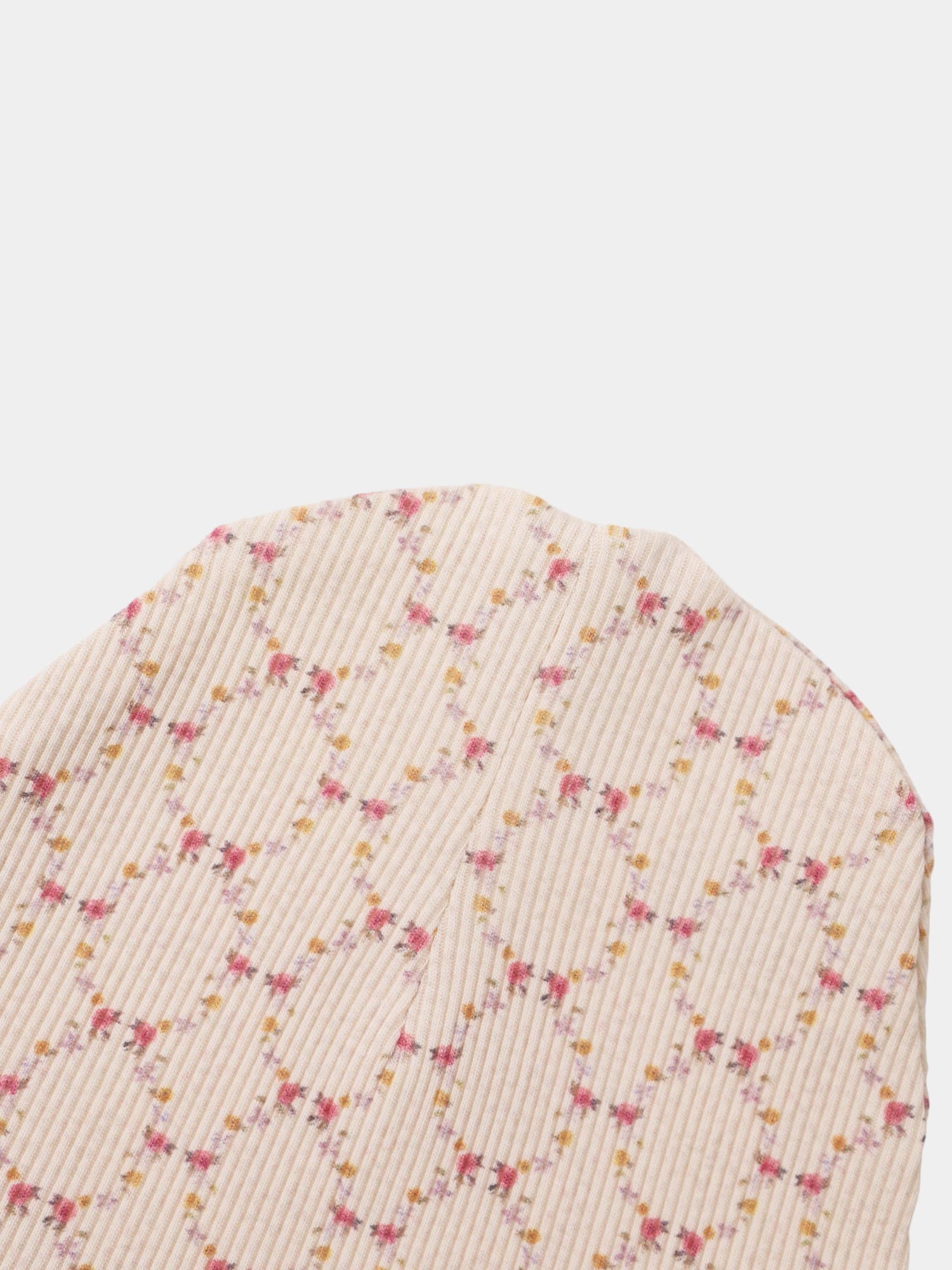 Floral Garland Layette Set, cream ribbed fabric with tiny pink and yellow floral garlands scattered along the texture.