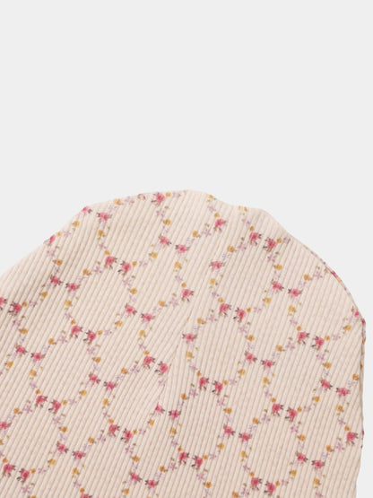 Floral Garland Layette Set, cream ribbed fabric with tiny pink and yellow floral garlands scattered along the texture.