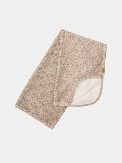 Pastel Petal layette blanket by Adee; floral pink and green print with white lining, tag visible.