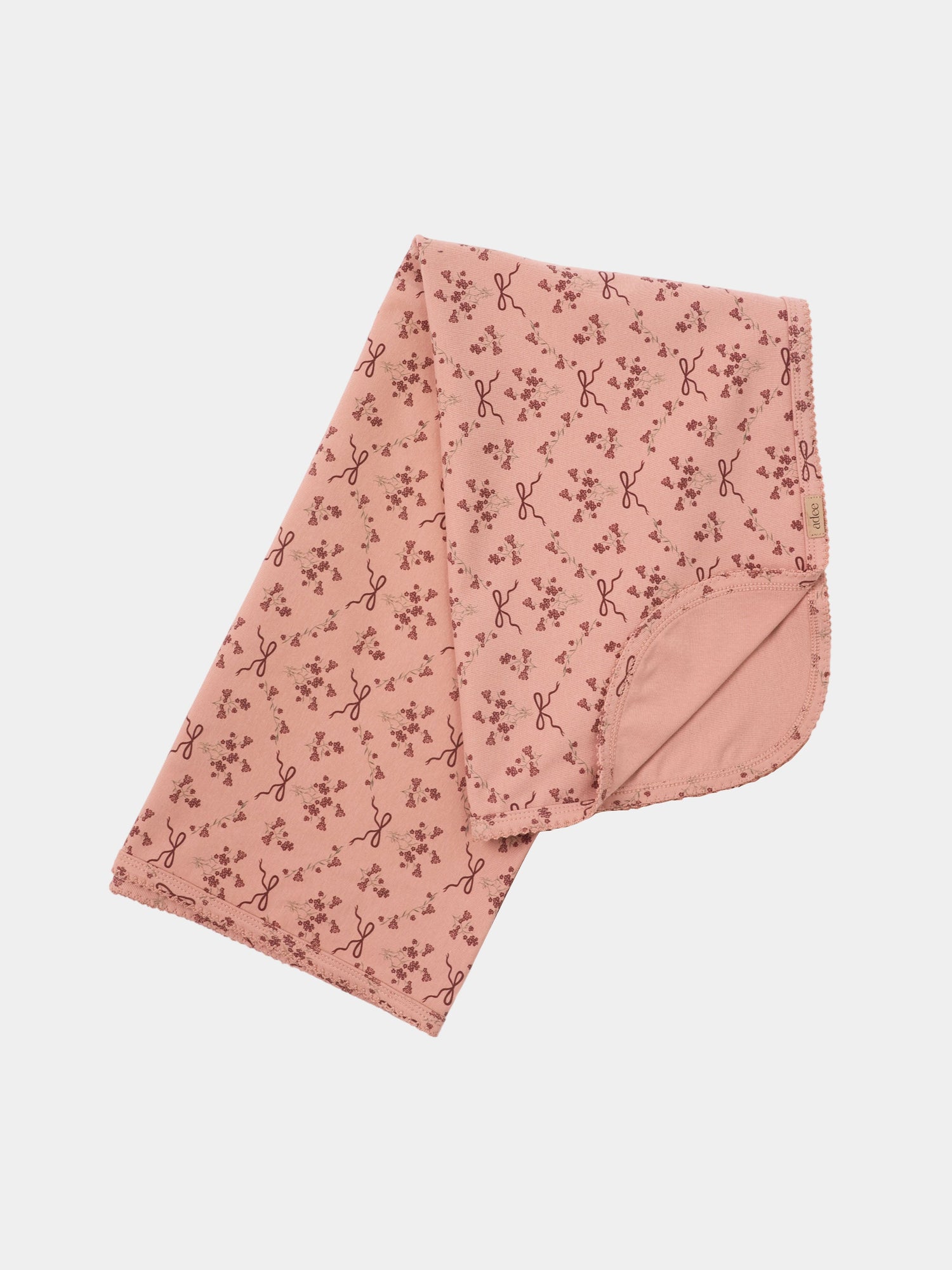 Bow Bouquet Layette Set by Adee in pink with tiny floral prints and bow motifs.