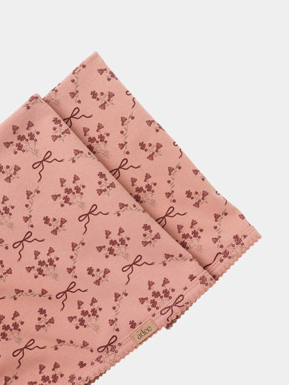 Adee Bow Bouquet Layette Set for girls; pink fabric with tiny floral clusters and ribbon bow motifs.