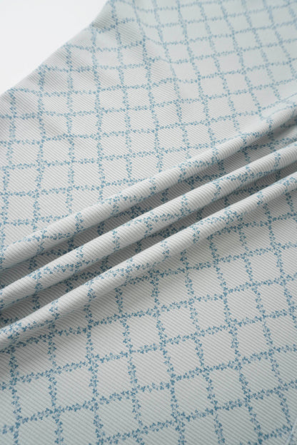 Blue Leaf Layette Set fabric with white base and light blue grid pattern