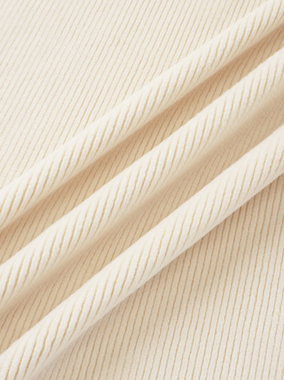 Layette fabric close-up in cream, ribbed knit texture for baby sets