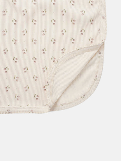 Tiny Tulip layette set for girls by Adee; pale pink fabric with small floral print and ribbed trim.