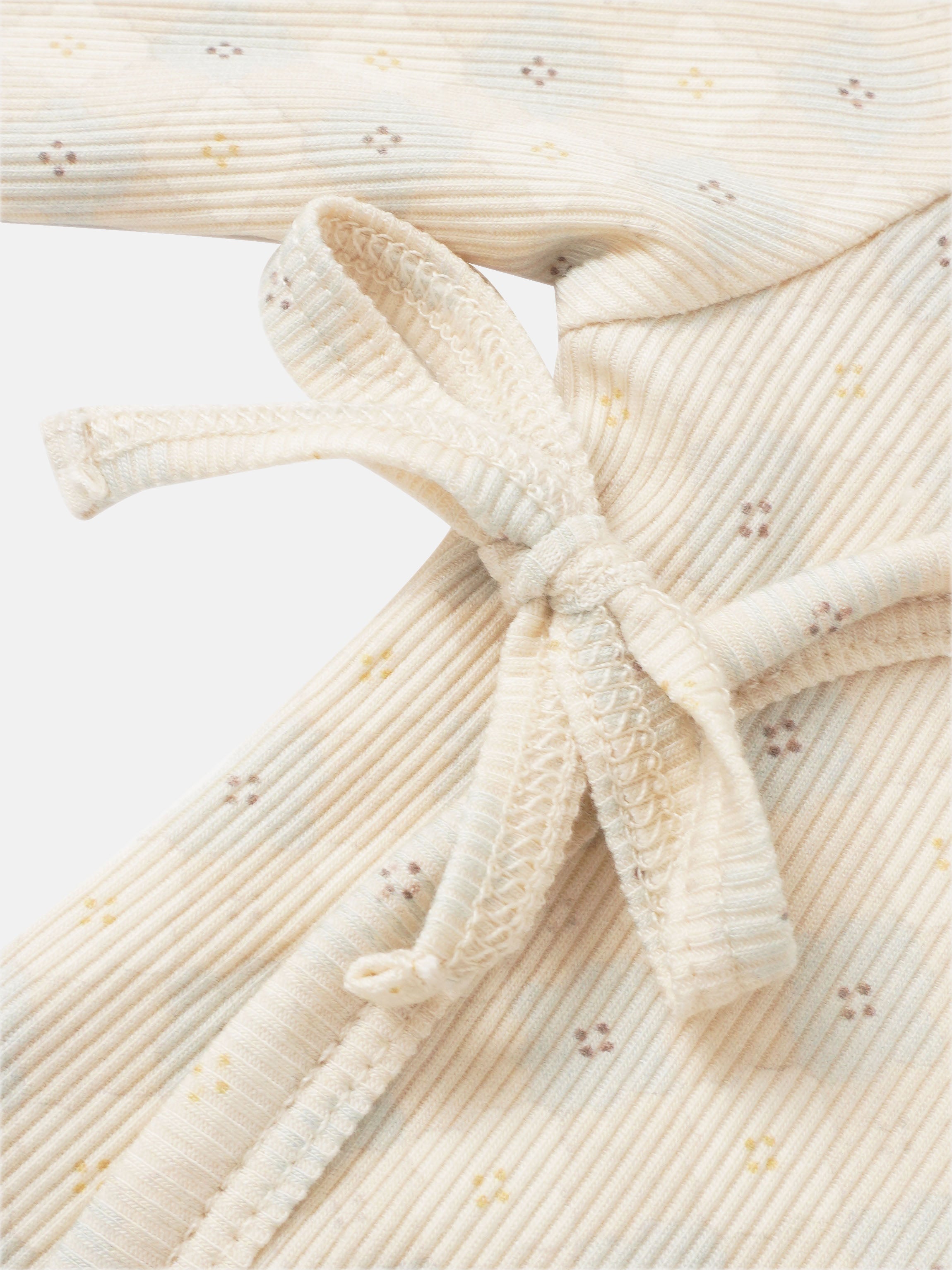 Little Button Blue layette set for boys by Adee, cream ribbed knit with tiny pastel specks.