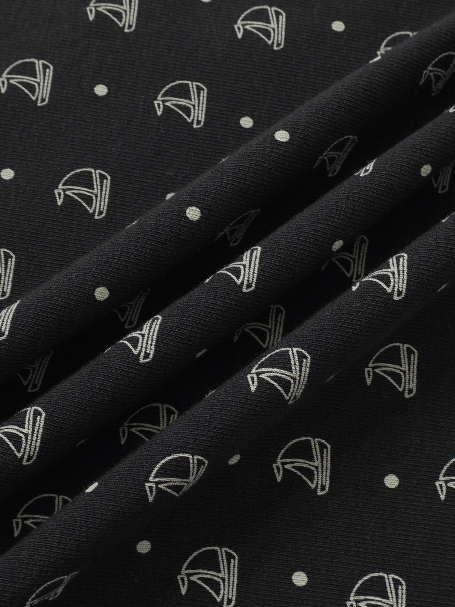 Harbor Dot layette set by Adee; navy fabric with white nautical boat icons and dots.