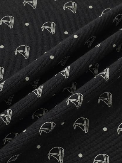 Harbor Dot layette set by Adee; navy fabric with white nautical boat icons and dots.