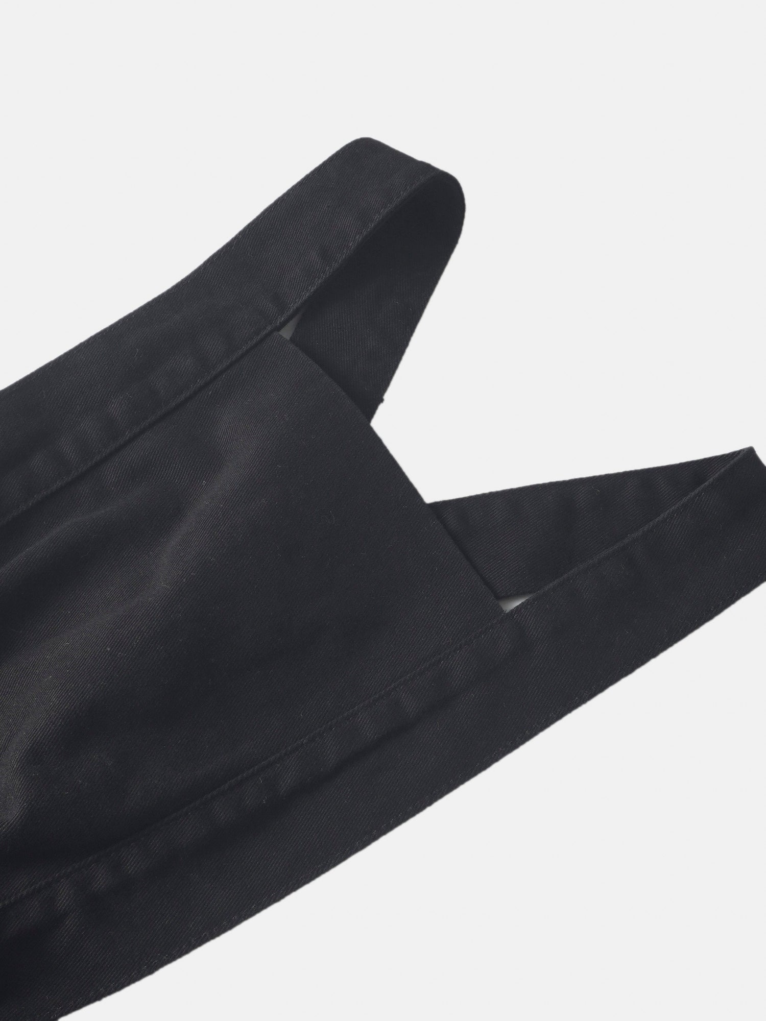 Black denim jumper dress for girls with wide straps and visible stitching