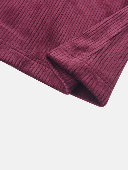 Ribbed velour burgundy girls pajamas fabric close-up with cuff detail.