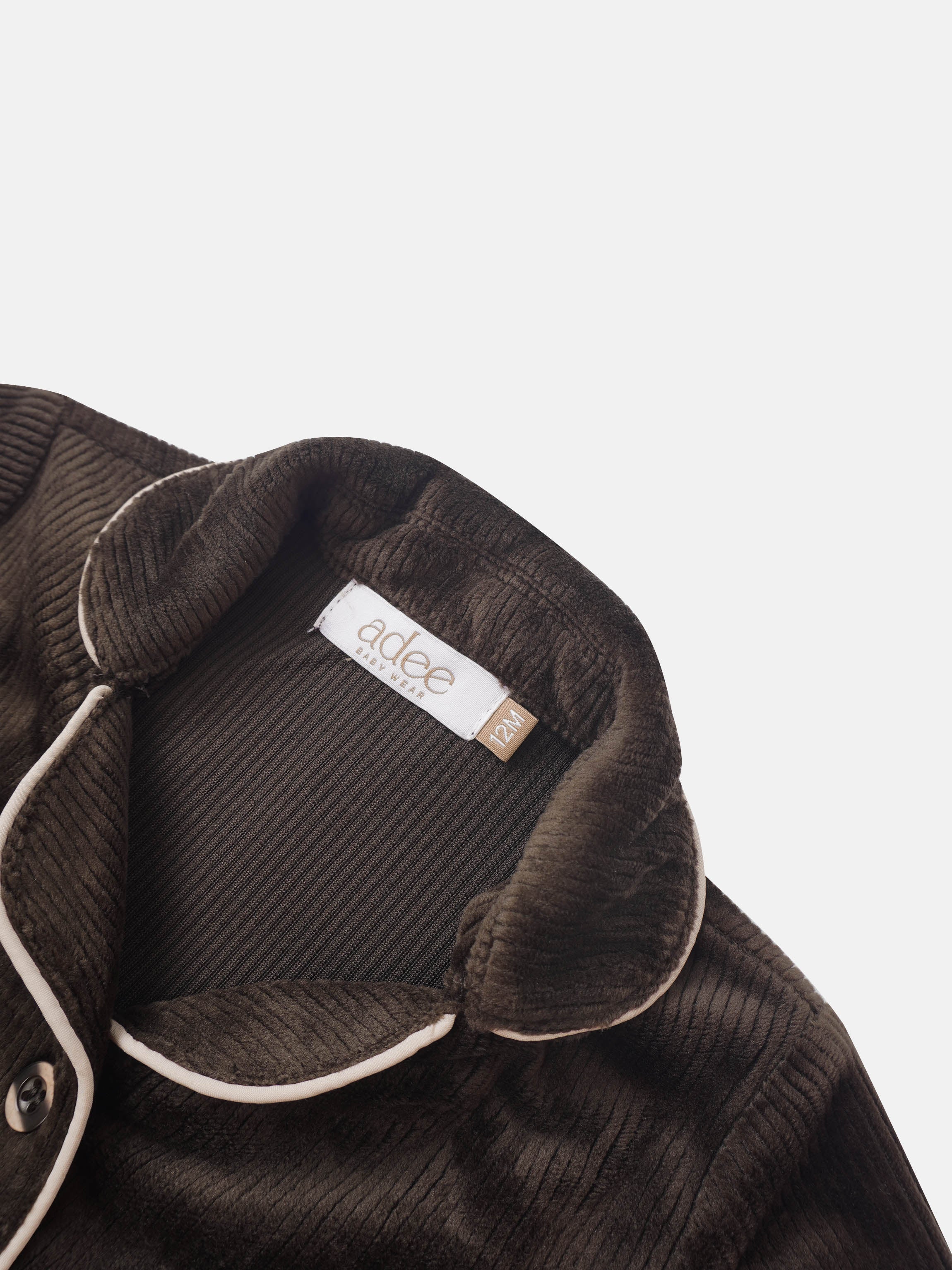 Brown ribbed velour pajamas for boys with white piping along the collar; Adee tag visible