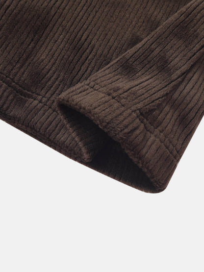 Ribbed velour boys pajamas in brown, close-up of fabric texture