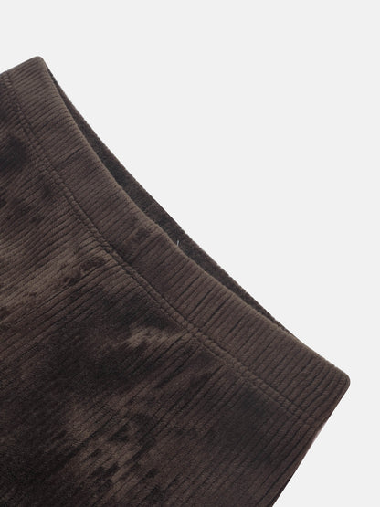 Ribbed velour boys pajamas in brown fabric, close-up texture