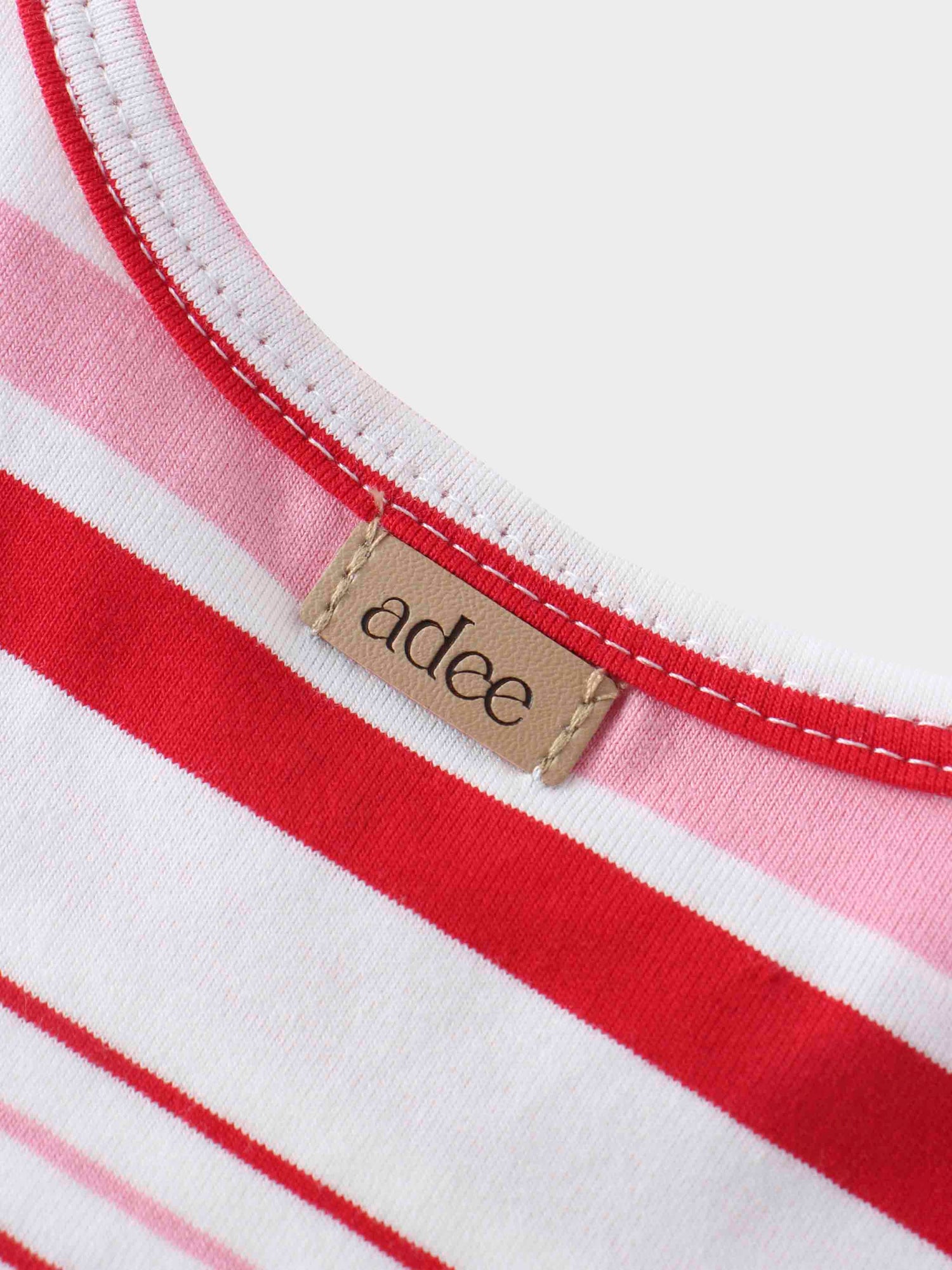Pink and red striped girls shirt neckline