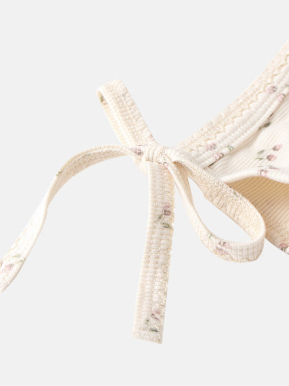 Tiny Tulip layette set by Adee; ivory floral print fabric with textured ribbon ties