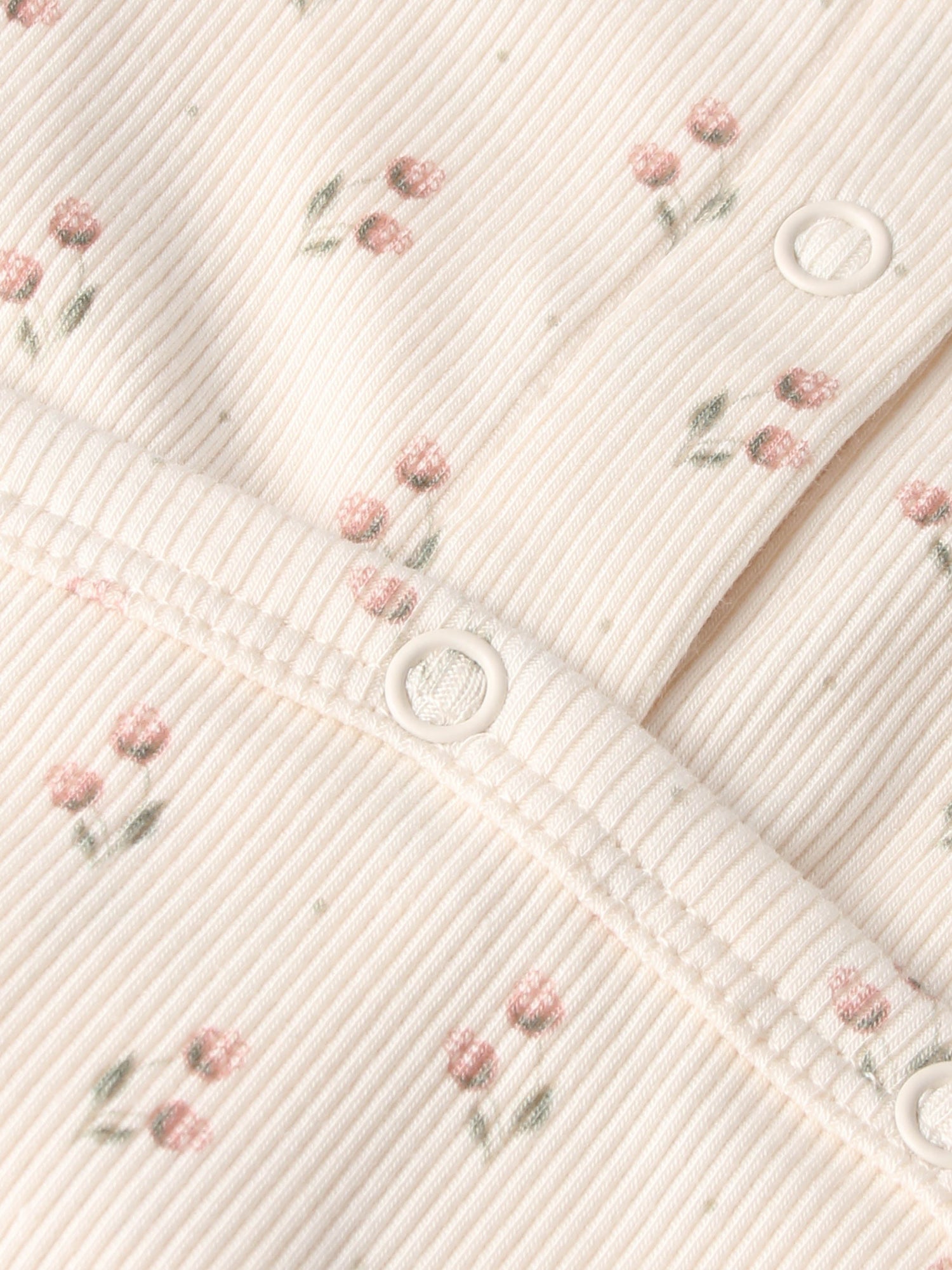 Tiny Tulip layette set by Adee; pale pink ribbed fabric with tiny pink flowers and white snap buttons.
