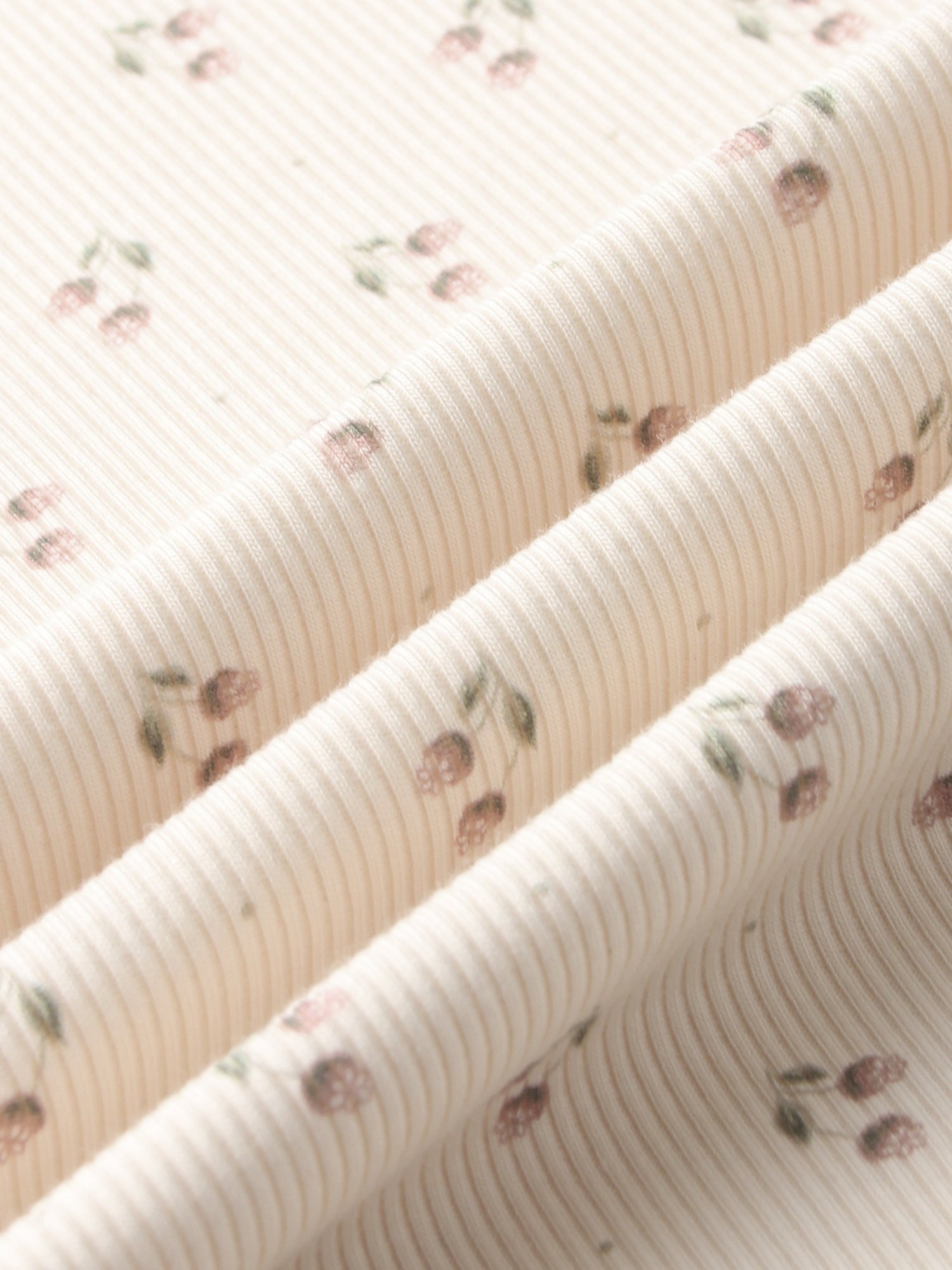 Tiny Tulip layette set fabric by Adee, pale pink striped knit with tiny pink tulip motifs