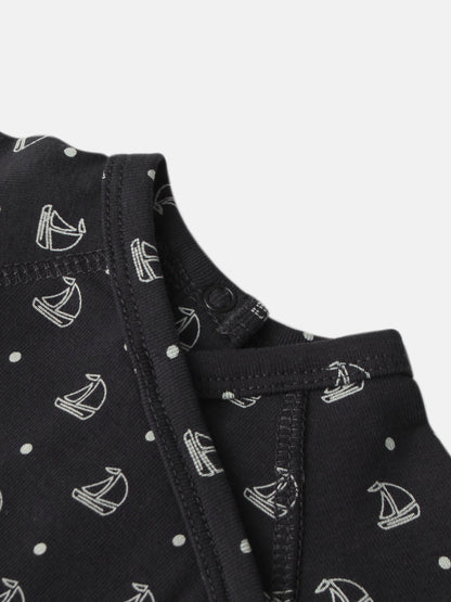 Harbor Dot layette set for boys; navy fabric with white sailboats and polka-dot pattern, close-up stitching.