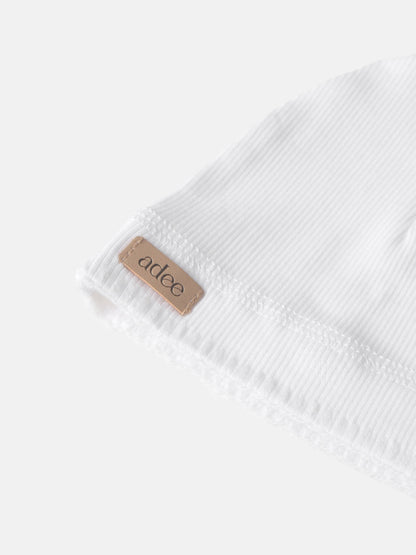 Legacy Stitch White layette set, unisex Adee brand in ribbed cotton with tan label.
