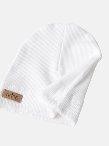 Legacy Stitch White layette set by Adee; unisex baby outfit in white with fine pinstripe and visible brand tag.