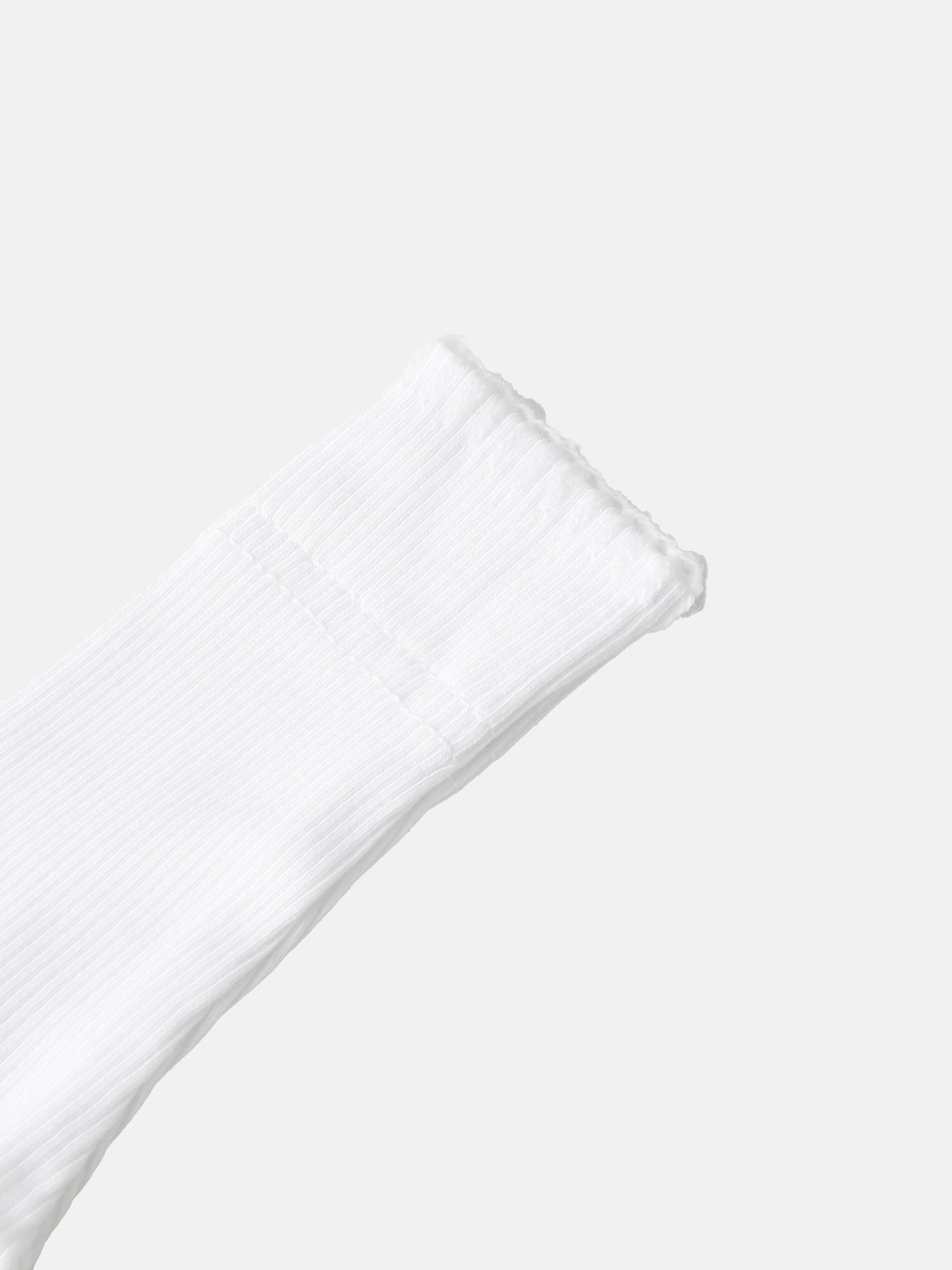 Legacy Stitch White Layette Set by Adee; close-up of white ribbed knit sleeve