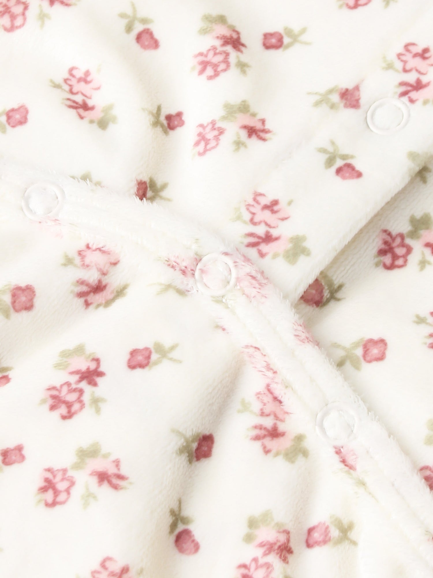 Tiny Blossom layette set by Adee; white fabric with pink floral print and snap buttons.