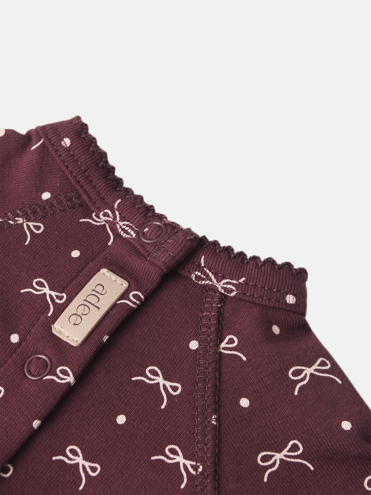 Burgundy Bow Stretchy for girls by Adee; knit fabric with white bow pattern and elastic smocked waist.