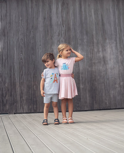 Striped Pink Skirt for girls by Adee; two children in matching striped outfits pose against a wooden backdrop.